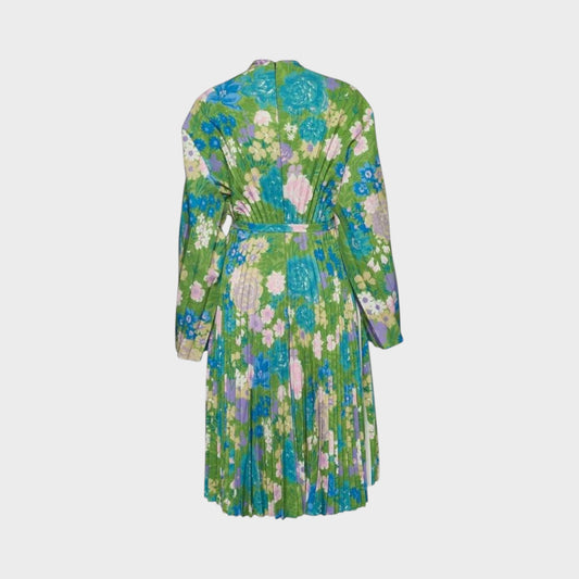 Tasoni Balenciaga semi-fitted dress in green with a vibrant floral print, long sleeves, and pleated skirt detail.