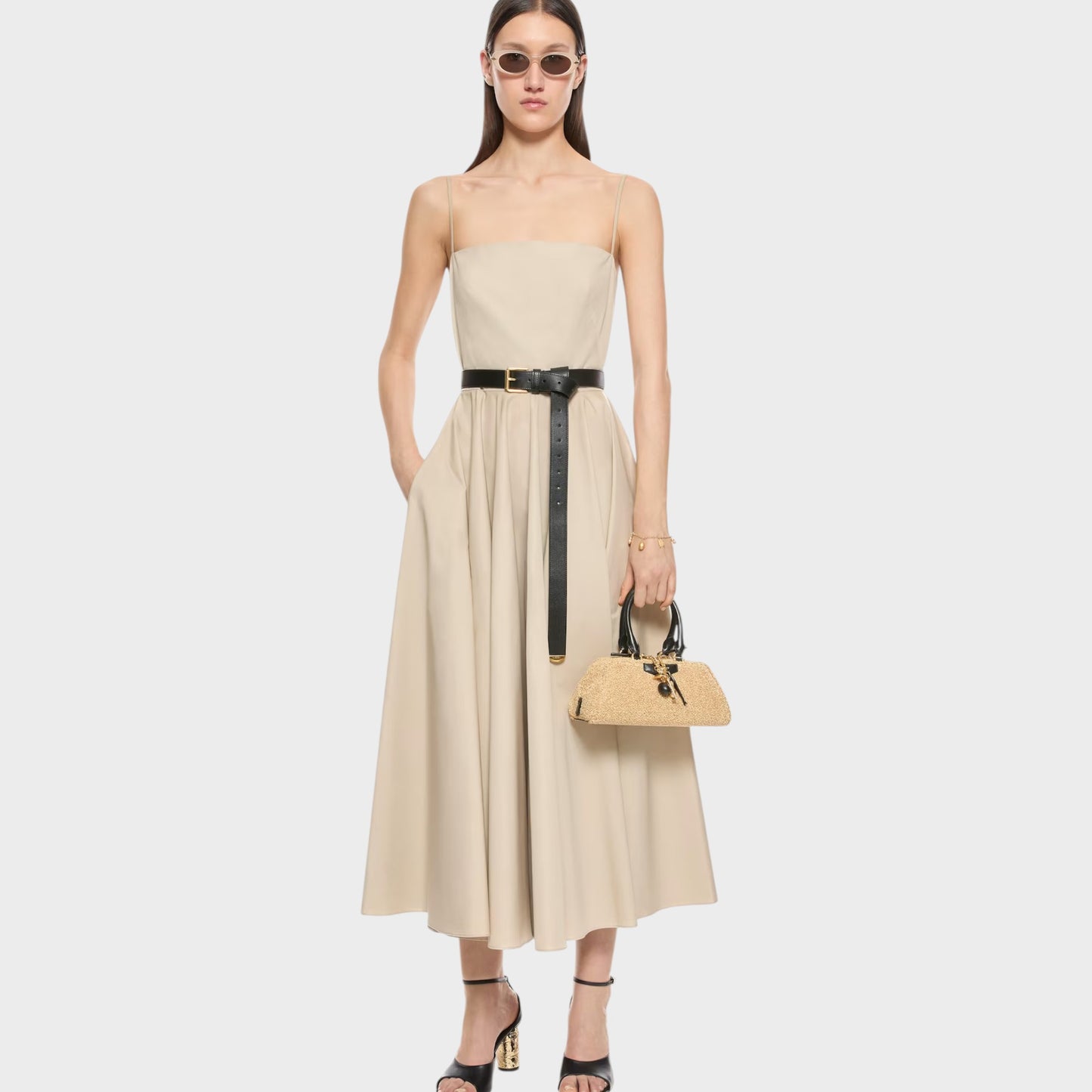 Tasoni beige Antigona East West bag in natural straw with black leather trim and gold hardware.