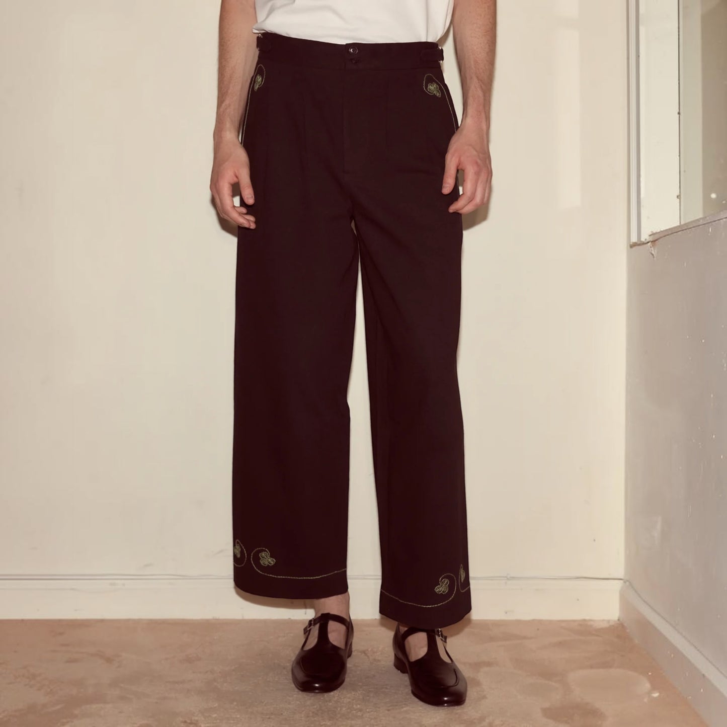 Tasoni black mid-rise trousers with embroidered playing card motifs on pockets and hem.