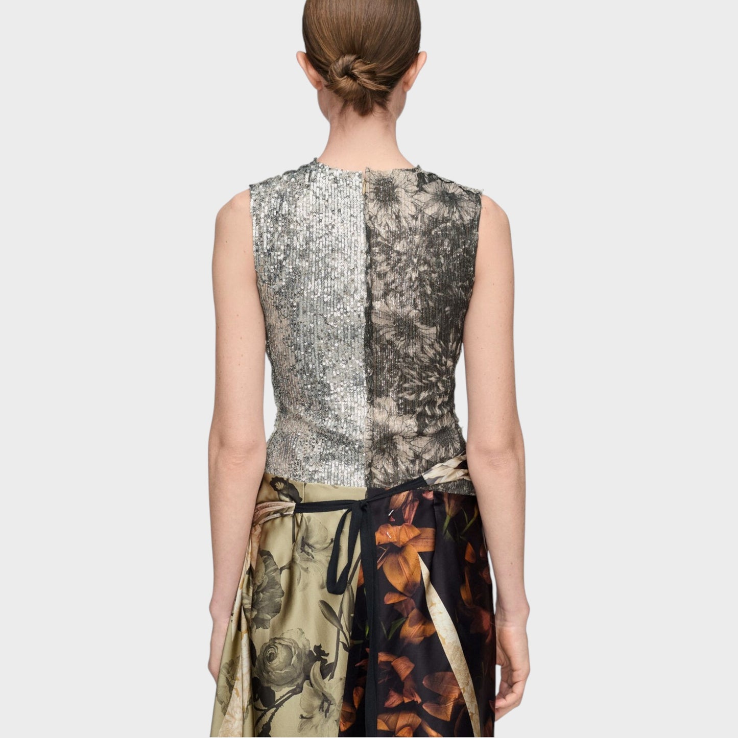 Tasoni Maison Margiela grey sequin crew neck sleeveless floral top with a split design, featuring silver sequins on the left and a dark floral print on the right.