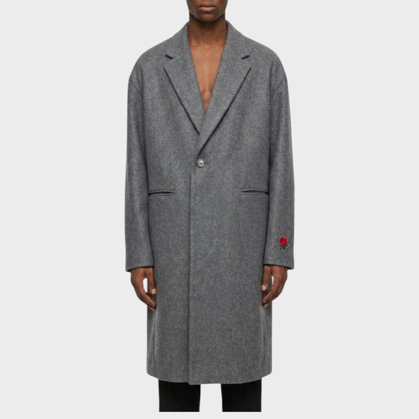 Tasoni charcoal grey wool and cashmere blend coat with rose embroidery on the sleeve. Men's long coat with classic lapels and single button closure.