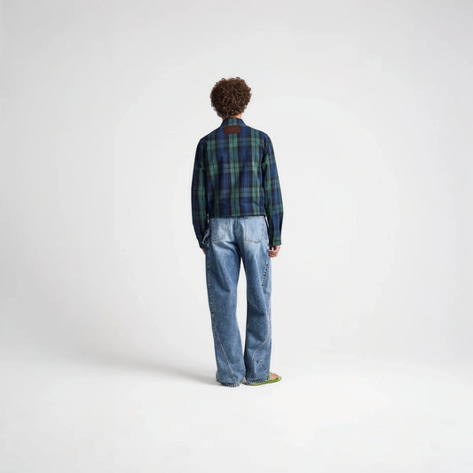 Model wearing Tasoni J.W.Anderson navy and green cotton check print collared zip jacket with blue jeans from behind.