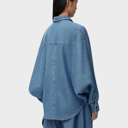 Tasoni Loewe oversized denim shirt in light blue wash, featuring a relaxed fit and dropped shoulders.