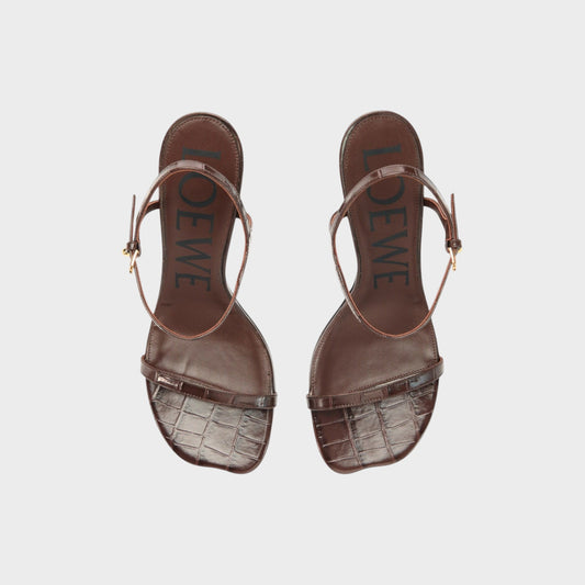 Tasoni Loewe Toy Croc 90mm Sandal Heels in dark brown patent leather with ankle strap and embossed logo.