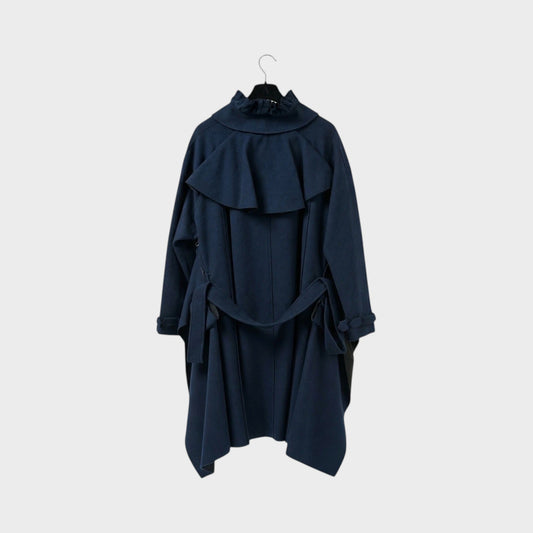 Tasoni navy blue wool coat with ruffled collar and tie waist. Features a dramatic cape-like overlay and cut-out details.