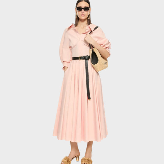 Tasoni pink silk poplin circular midi skirt with a collared neckline and puffed sleeves, cinched with a black belt.