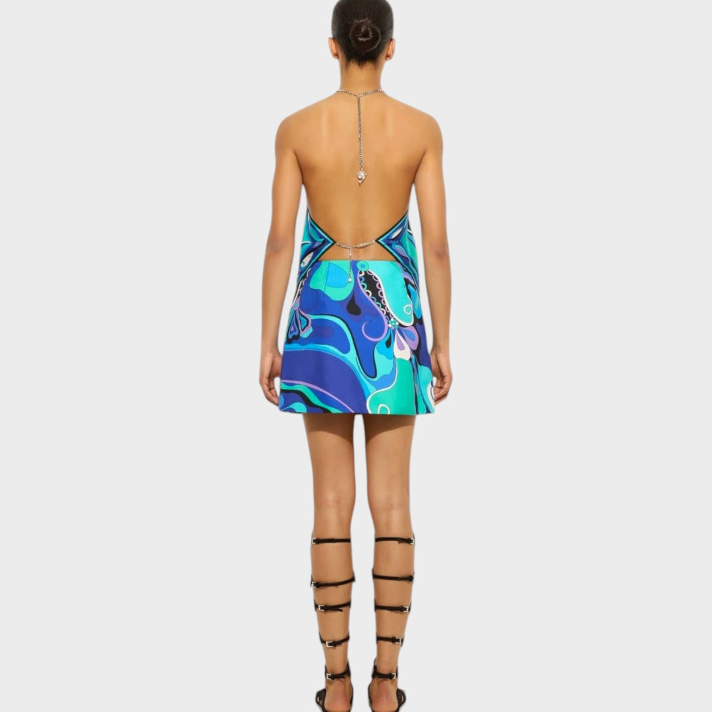 Tasoni Pucci silk chain halter top in turquoise blue with Orchidee print, worn by a model with gladiator sandals.