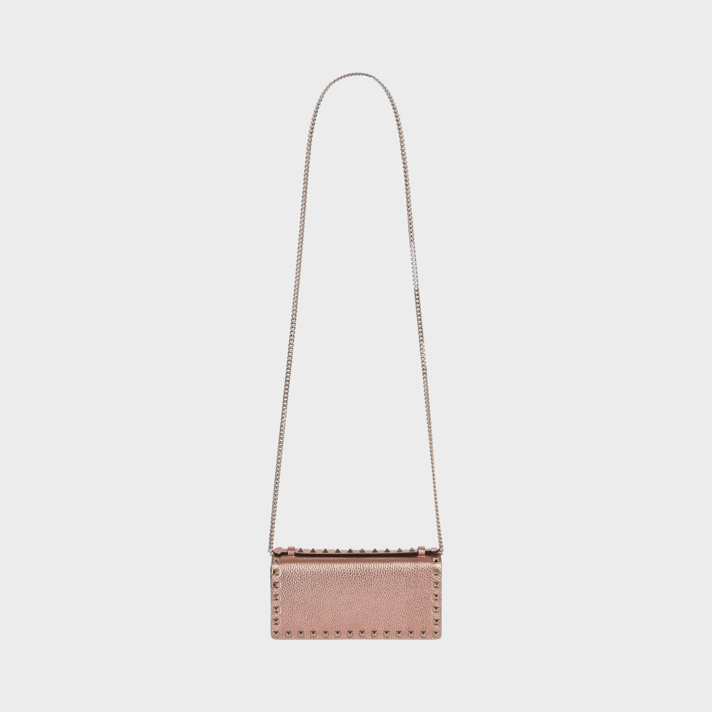 Tasoni Valentino Rockstud wallet in rose gold metallic leather with pyramid stud detailing and silver chain strap.