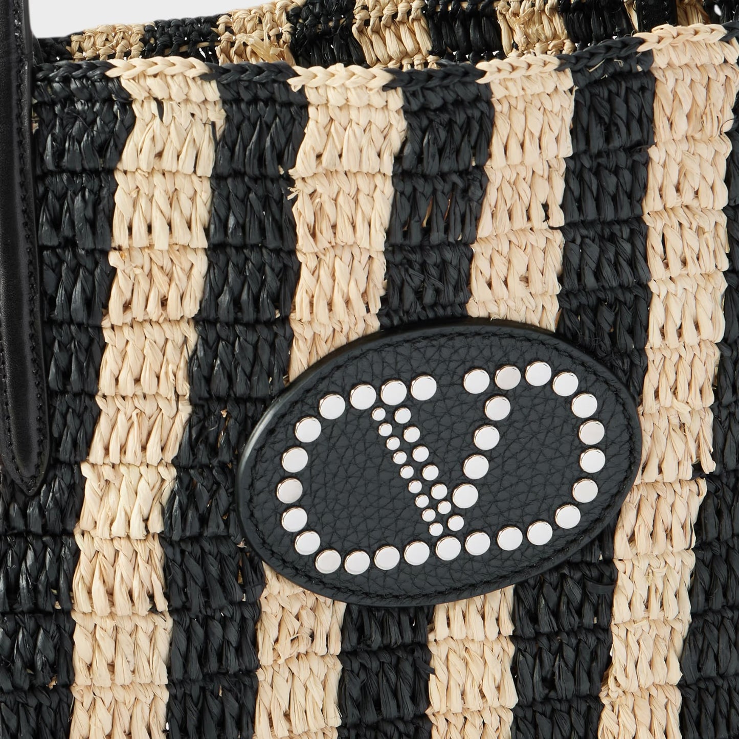 Tasoni Valentino V-Logo crochet raffia bucket bag with black and natural stripes and leather trim.