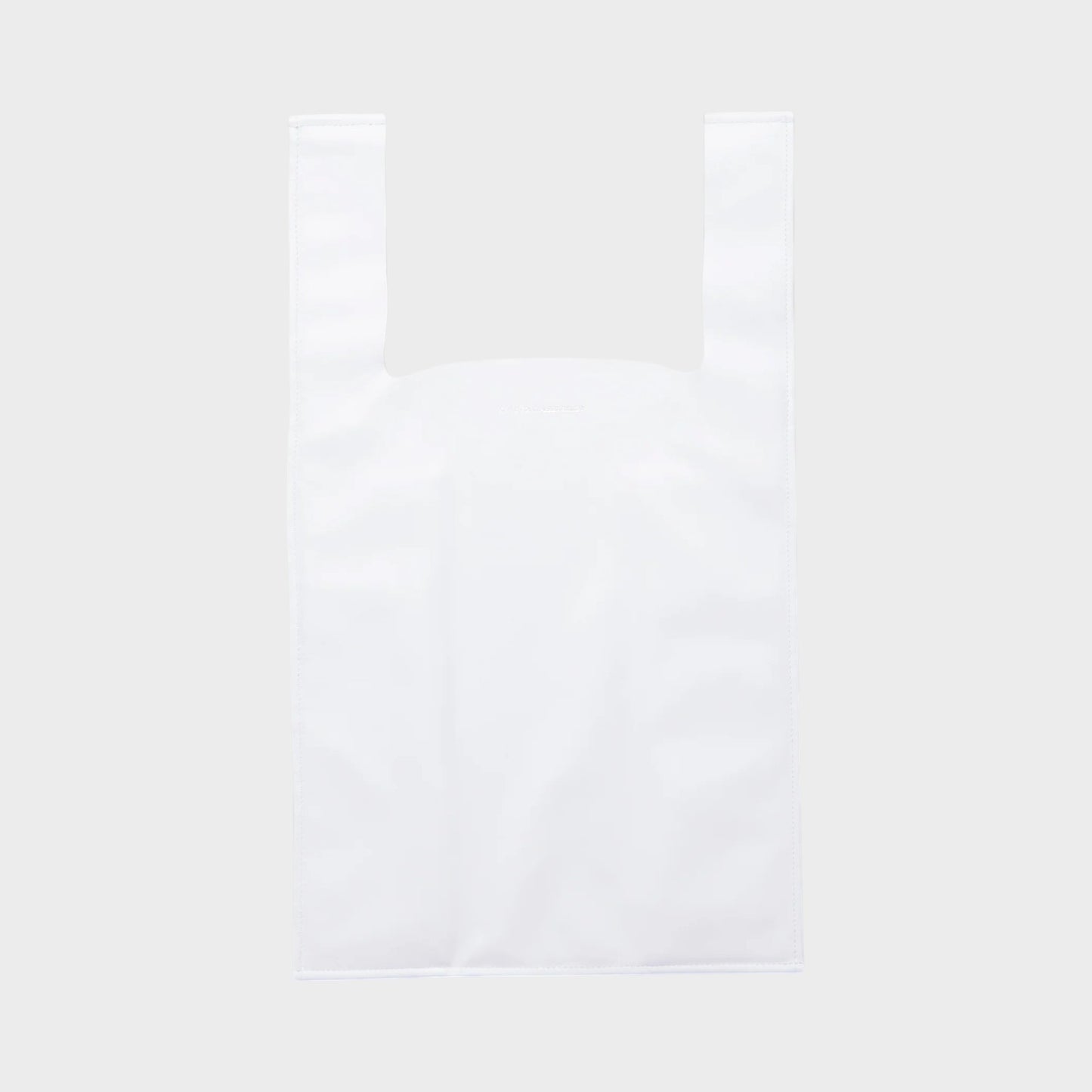 Tasoni Marie Adam-Leenaerdt white leather tote bag with "Thank You" print and dual top handles.