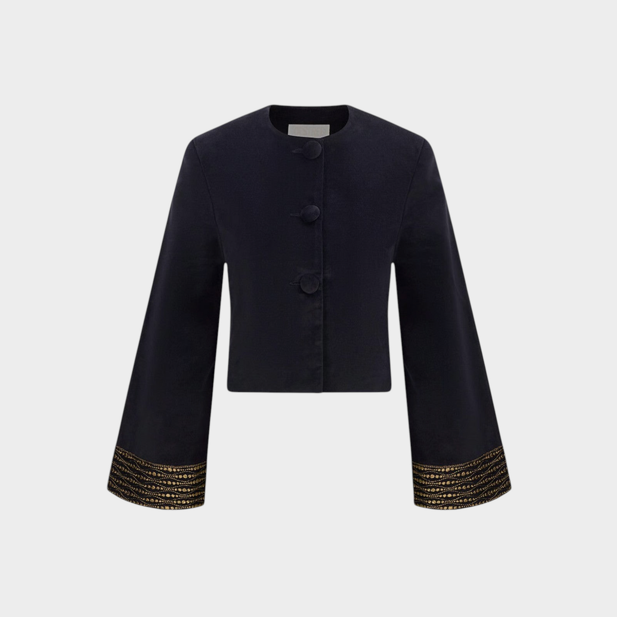 Tasoni Destree black velvet jacket with structured shoulders and intricate gold lace detailing on the flared sleeves.