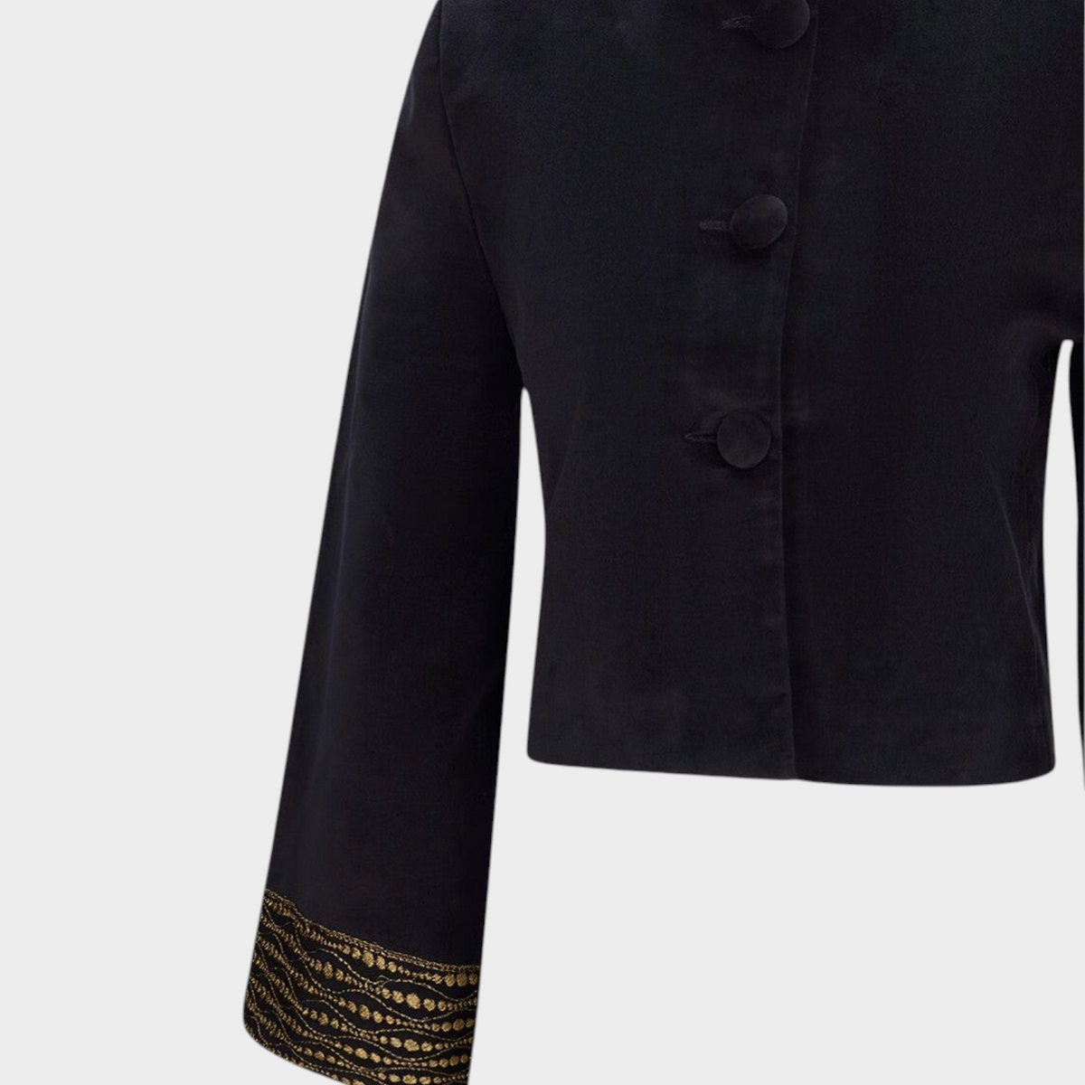 Tasoni Destree black velvet jacket with structured shoulders, concealed buttons, and gold lace cuff detail.