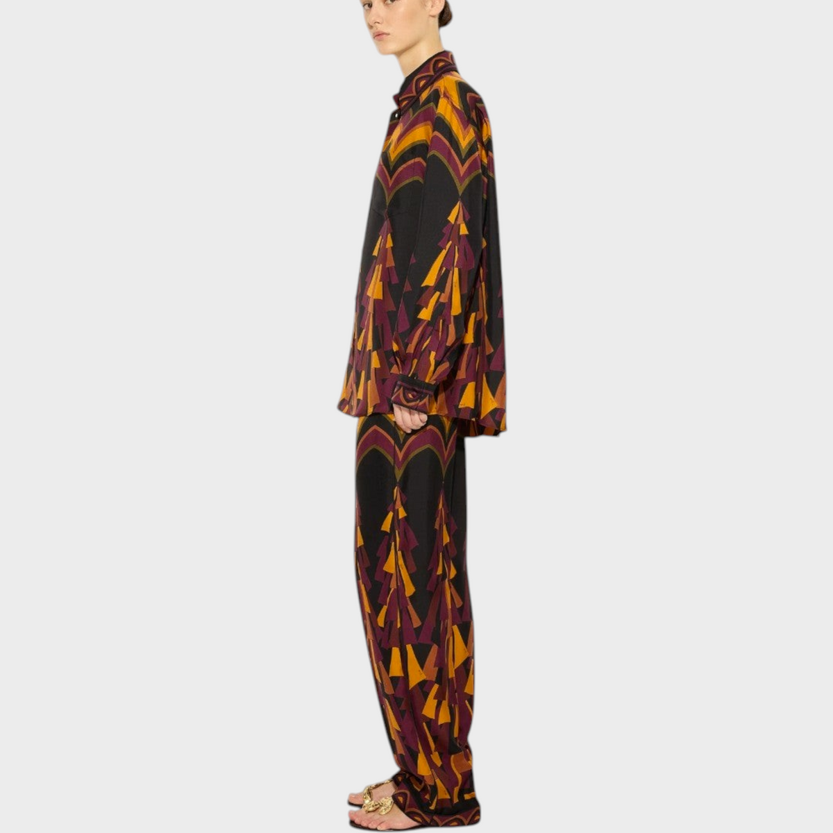 Tasoni Pucci silk twill shirt and matching trousers in a vibrant orange and black geometric print, side view