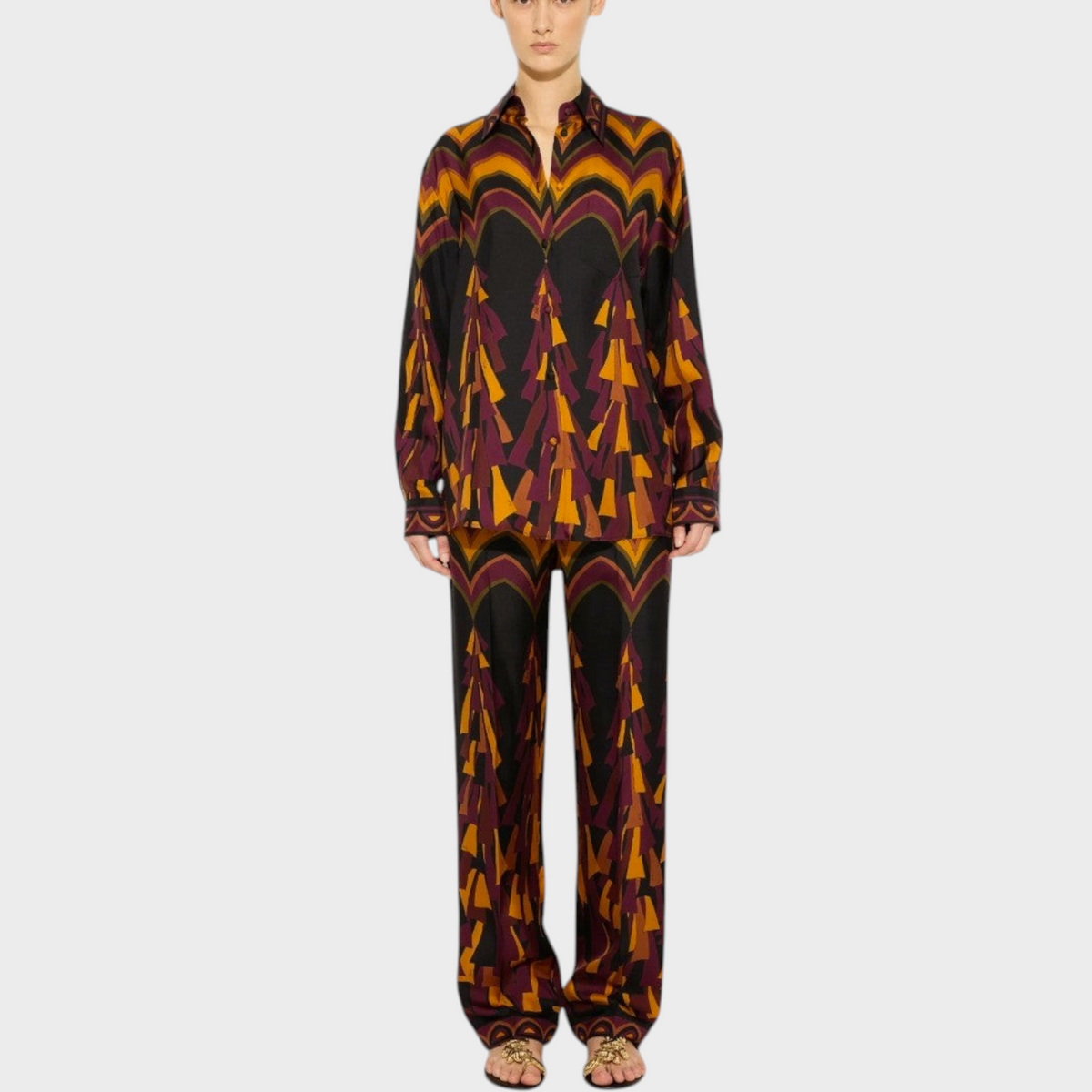 Tasoni Pucci silk twill shirt and trousers set in vibrant orange and purple geometric print on a model