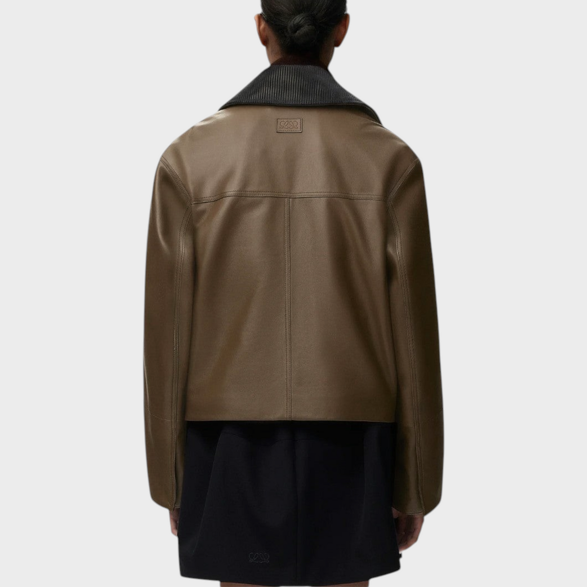 Back view of Tasoni Loewe khaki nappa leather short parka with a stand collar and smooth finish on a model.