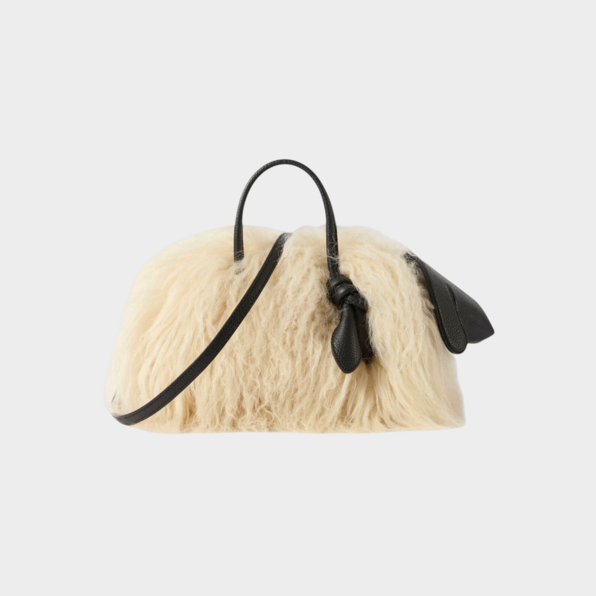 Tasoni Jacquemus Le Petit Turismo bowling bag in off-white shearling with black leather handles and knot detail.