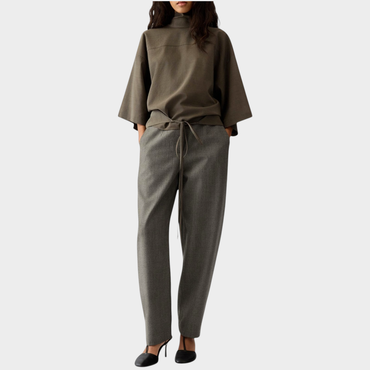 Tasoni Jacquemus Le Pantalon Citta dark brown wool straight tailored trousers worn with a matching high-neck top.