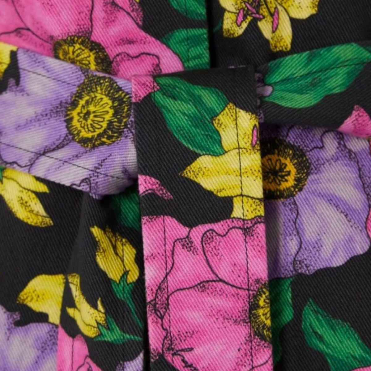 Tasoni Balenciaga cotton drill trench coat featuring a vibrant black, purple, and pink floral print with a tie belt