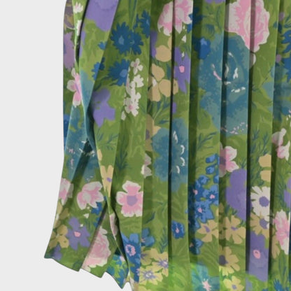 Tasoni Balenciaga floral print semi-fitted dress featuring green fabric with pink and purple flowers and pleat detail
