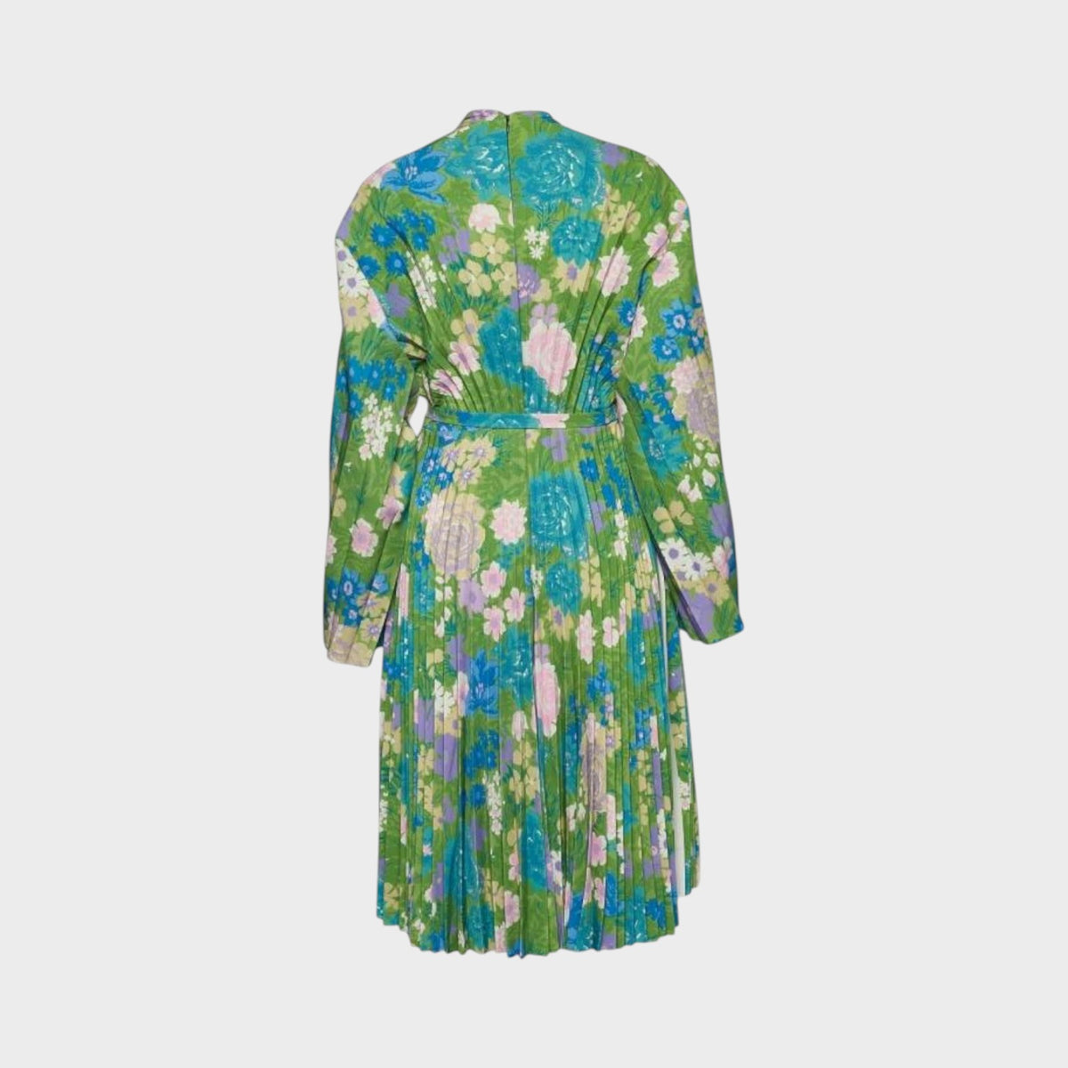 Tasoni Balenciaga semi-fitted dress in green with a vibrant floral print, long sleeves, and pleated skirt detail.