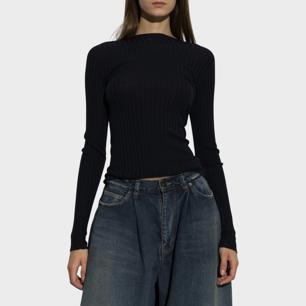 Tasoni Balenciaga navy wool ribbed crew neck sweater worn by a model with blue jeans
