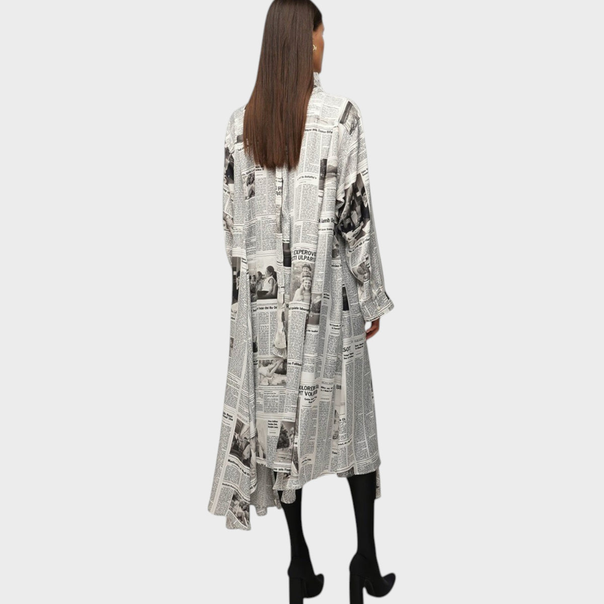 Tasoni Balenciaga long sleeve satin dress featuring a black and white newspaper print with a tie neck detail.