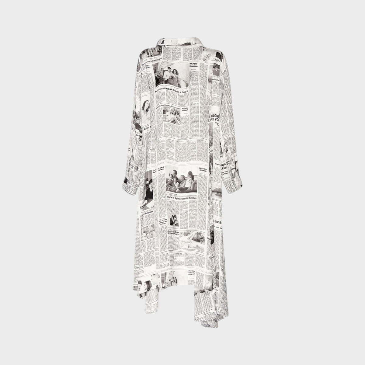 Tasoni Balenciaga long sleeve satin dress featuring a black and white newspaper Happy News print and tie neck detail.