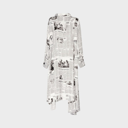 Tasoni Balenciaga long sleeve satin dress featuring a black and white newspaper Happy News print and tie neck detail.