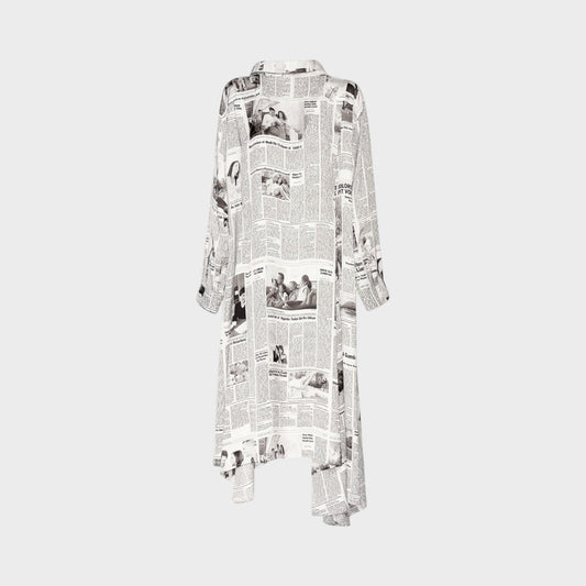 Tasoni Balenciaga long sleeve satin dress featuring a black and white newspaper Happy News print and tie neck detail.