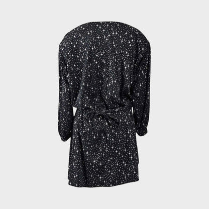 Tasoni Balenciaga black mini dress featuring a white star print, V-neckline, and long sleeves, back view.