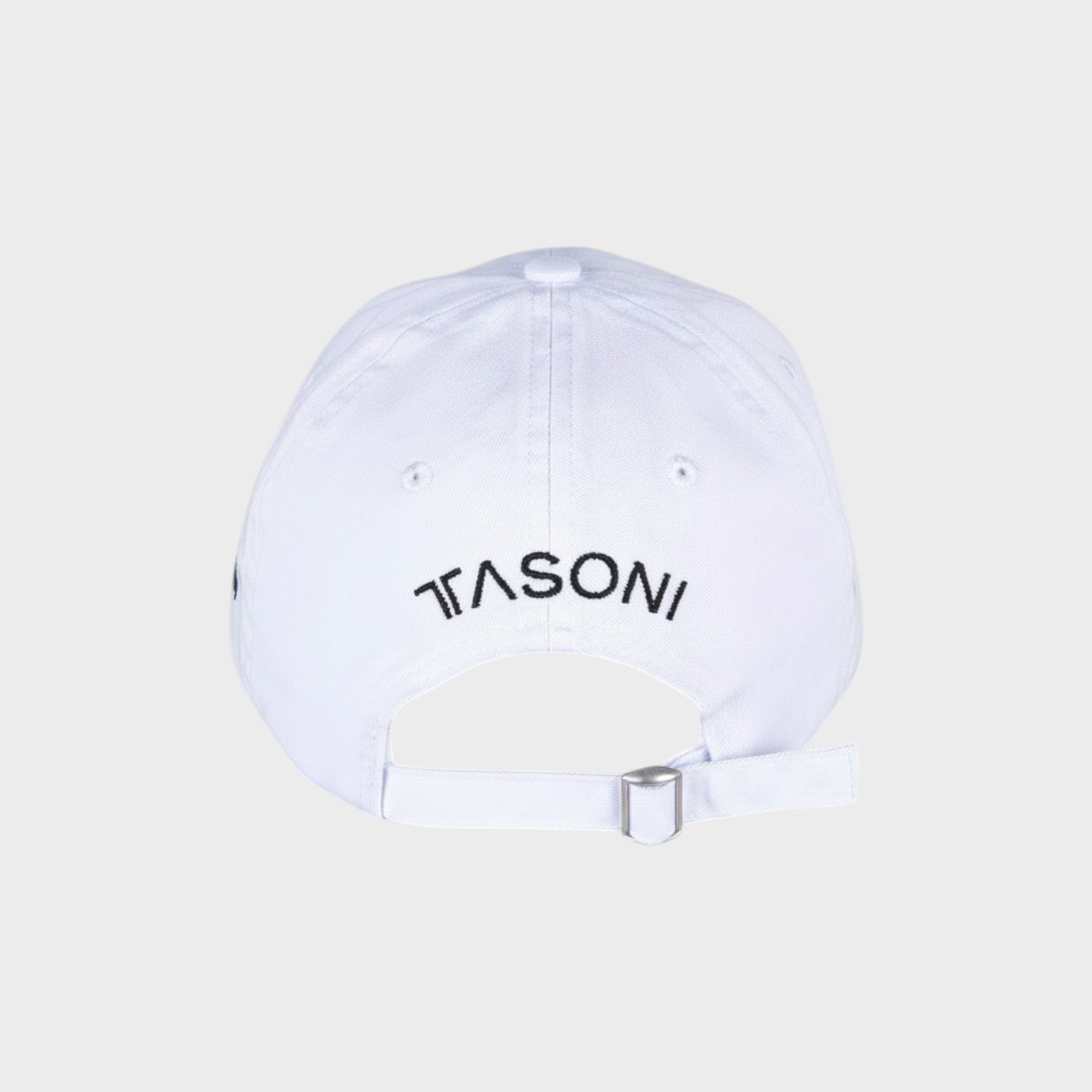 Tasoni x Tina Braegger white cotton baseball cap with embroidered logo on back and adjustable strap.