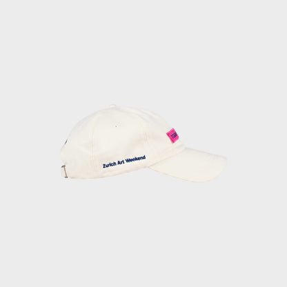 Tasoni x Jan Vorisek white cotton baseball cap with pink logo patch and blue "Zurich Art Weekend" embroidery.