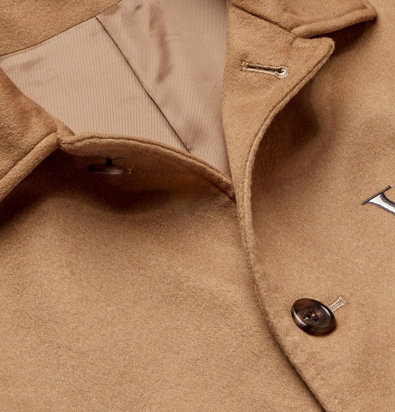 Tasoni beige cashmere coat with grey UFO embroidery and striped lining.