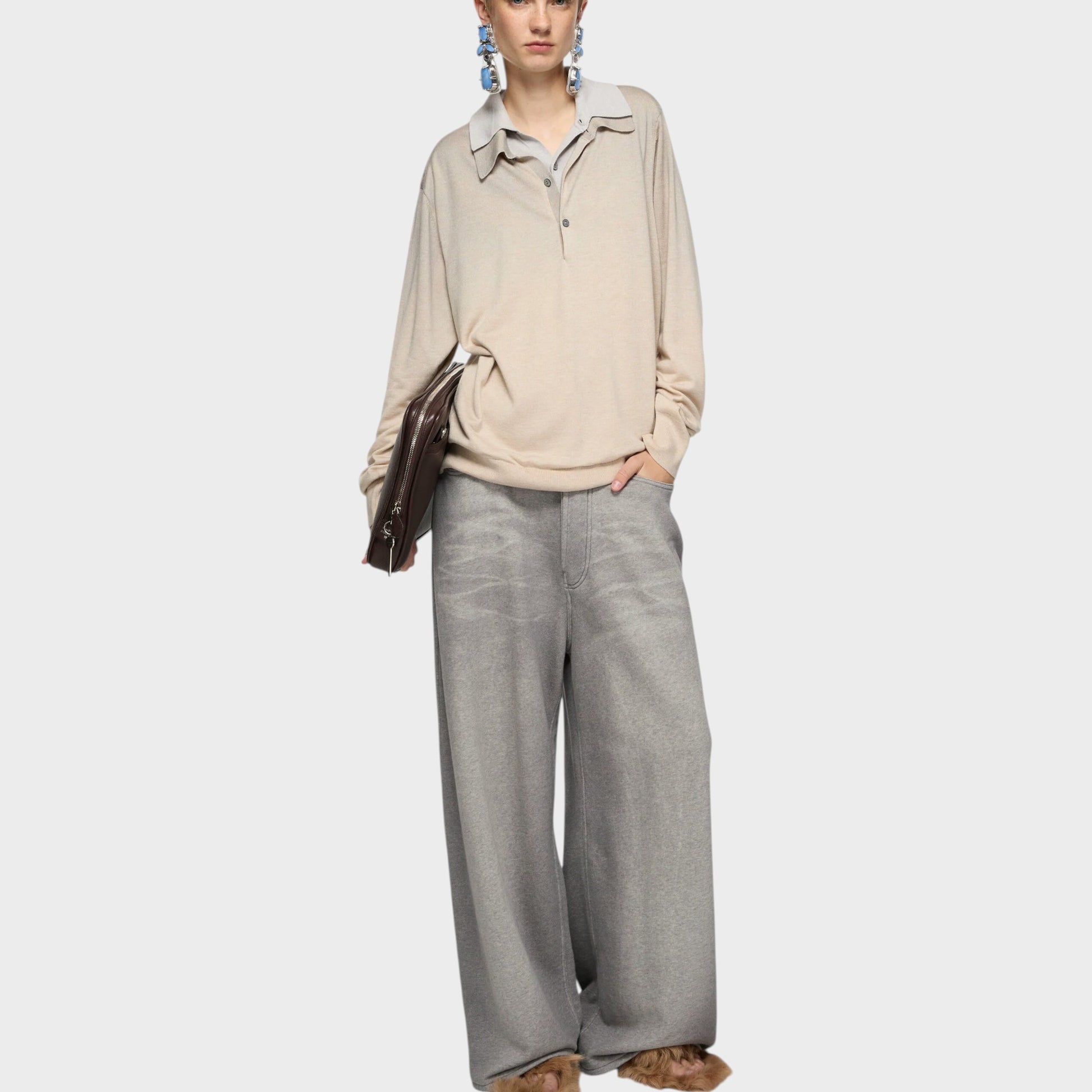 Tasoni beige silk and cashmere layered V-neck sweater with grey collar and cuffs, worn by a model with blonde hair and large blue earrings.