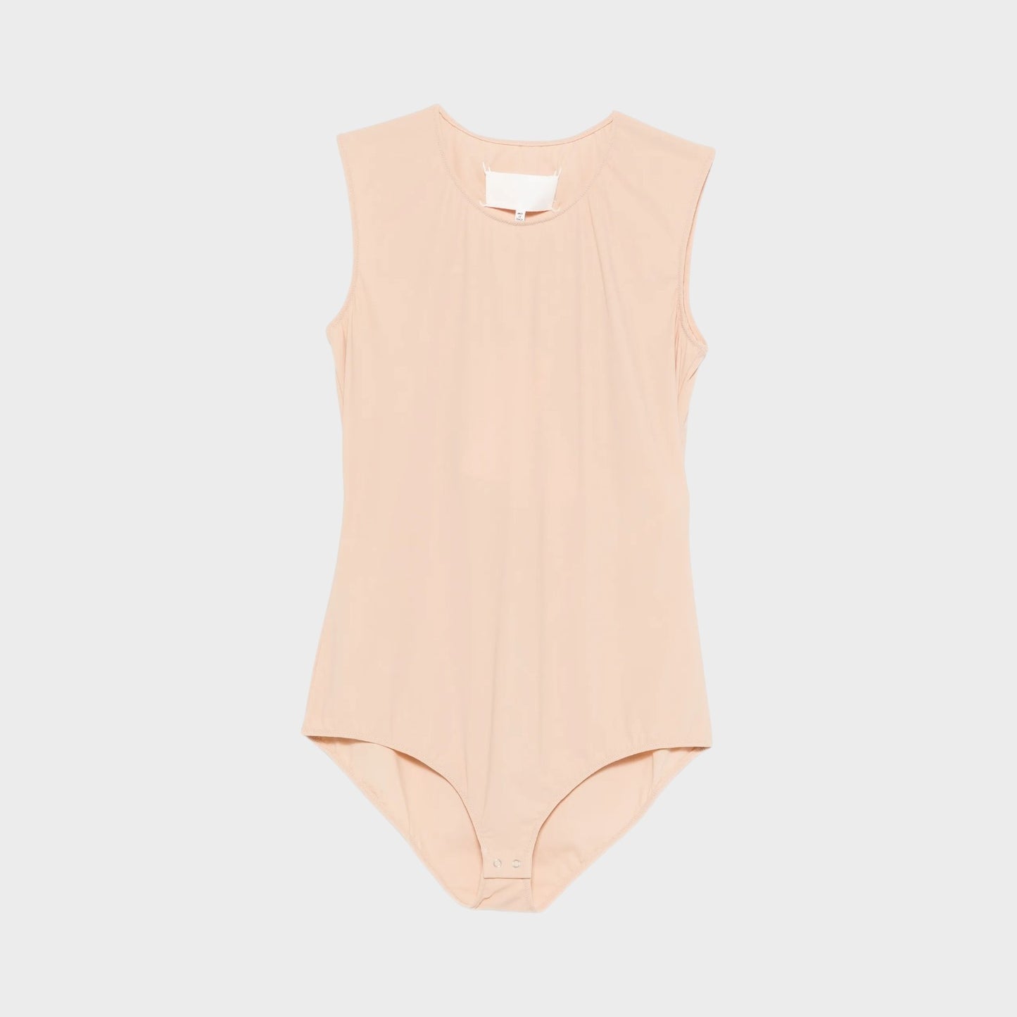 Tasoni beige crew neck sleeveless bodysuit in almond. Features a snap closure at the crotch.