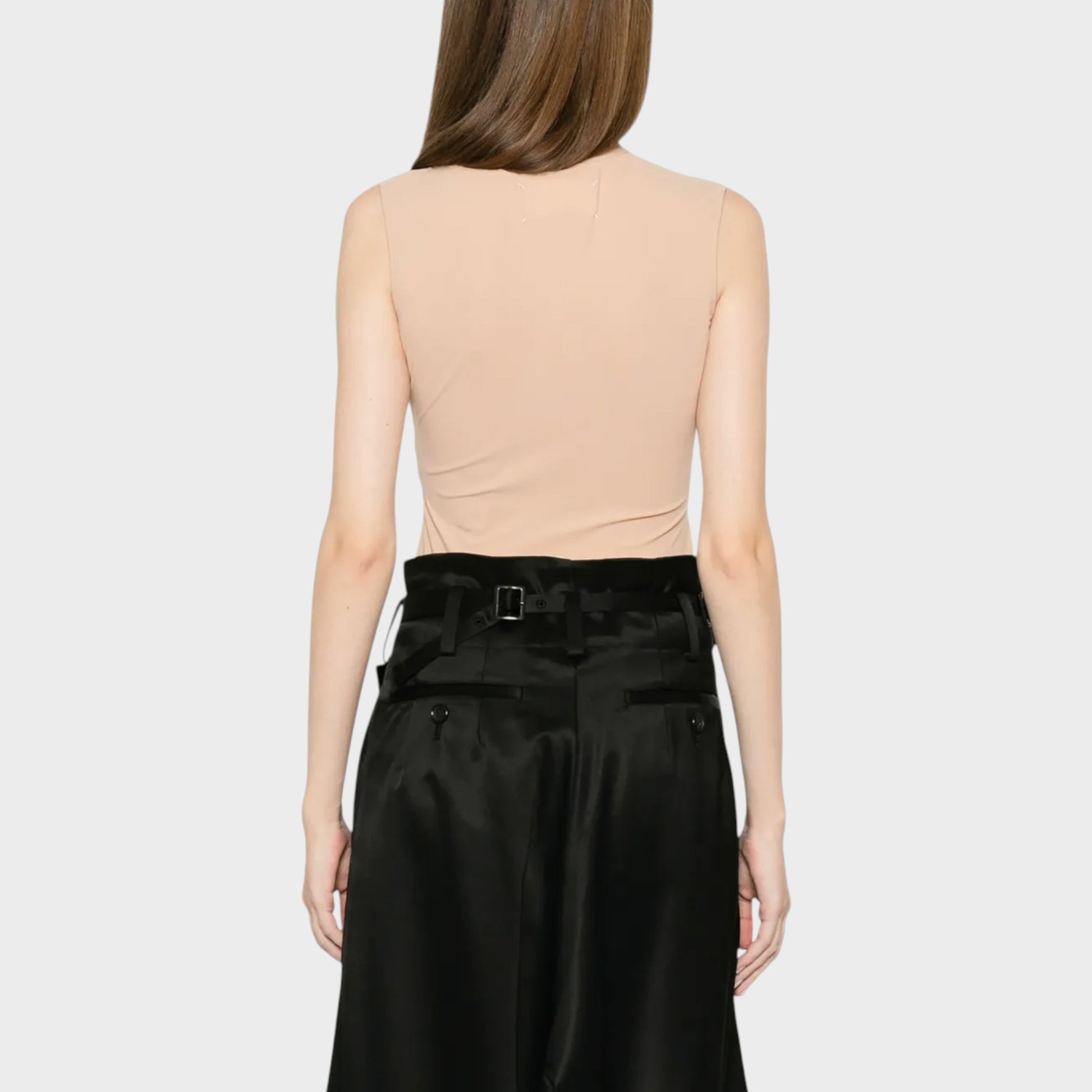 Tasoni Maison Margiela beige crew neck sleeveless bodysuit in almond. A model wears the back of the bodysuit.