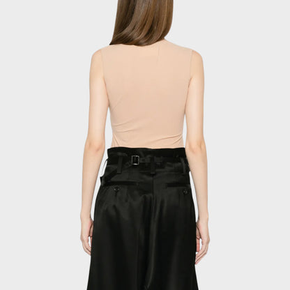 Tasoni Maison Margiela beige crew neck sleeveless bodysuit in almond. A model wears the back of the bodysuit.