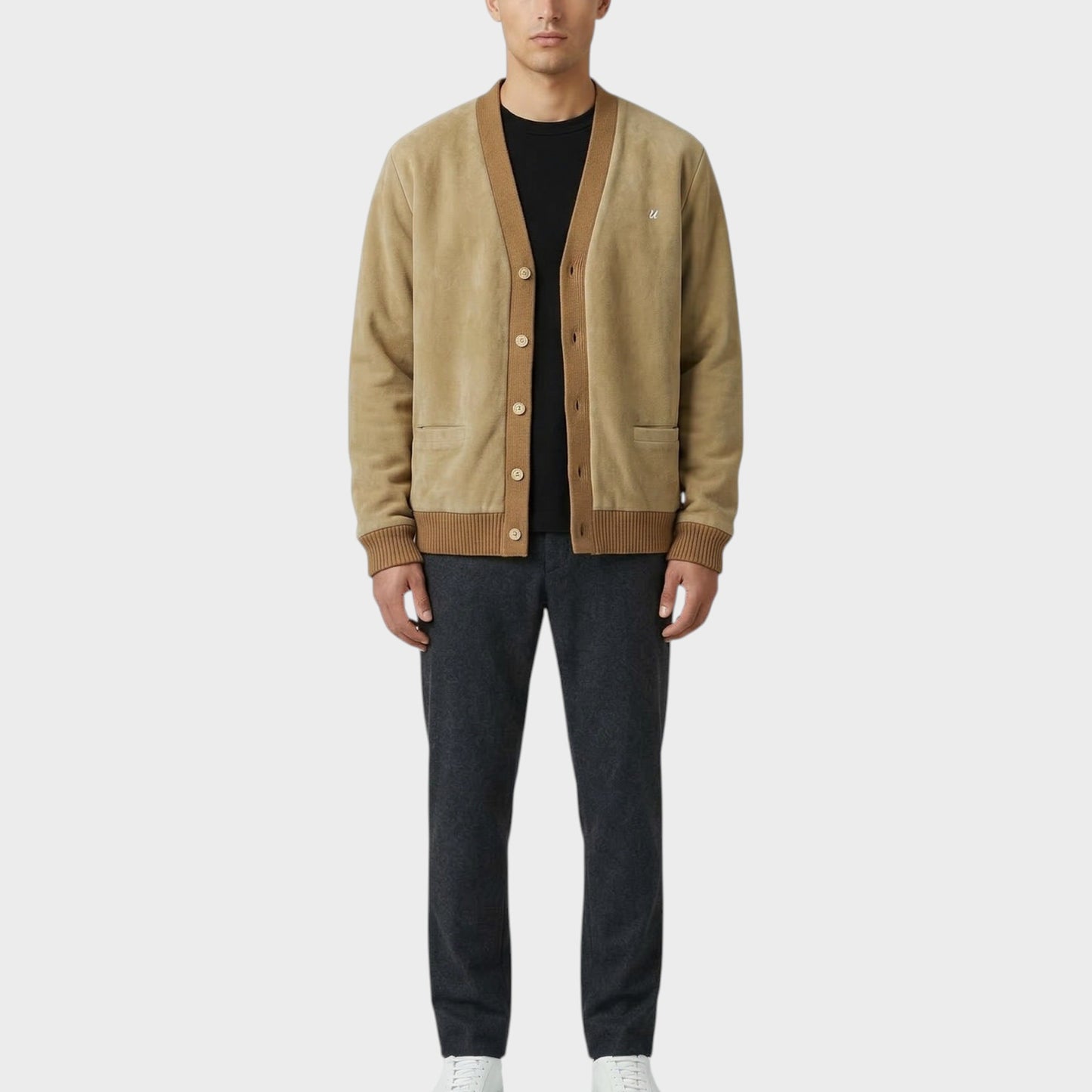 Tasoni beige suede and wool blend cardigan with brown trim and ribbed cuffs. Model wears black t-shirt and charcoal trousers.