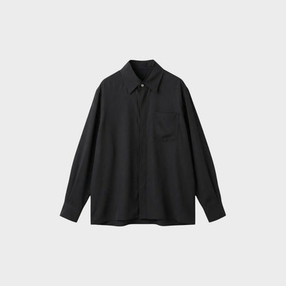 Tasoni classic black long-sleeve shirt with a single chest pocket and button-up front.