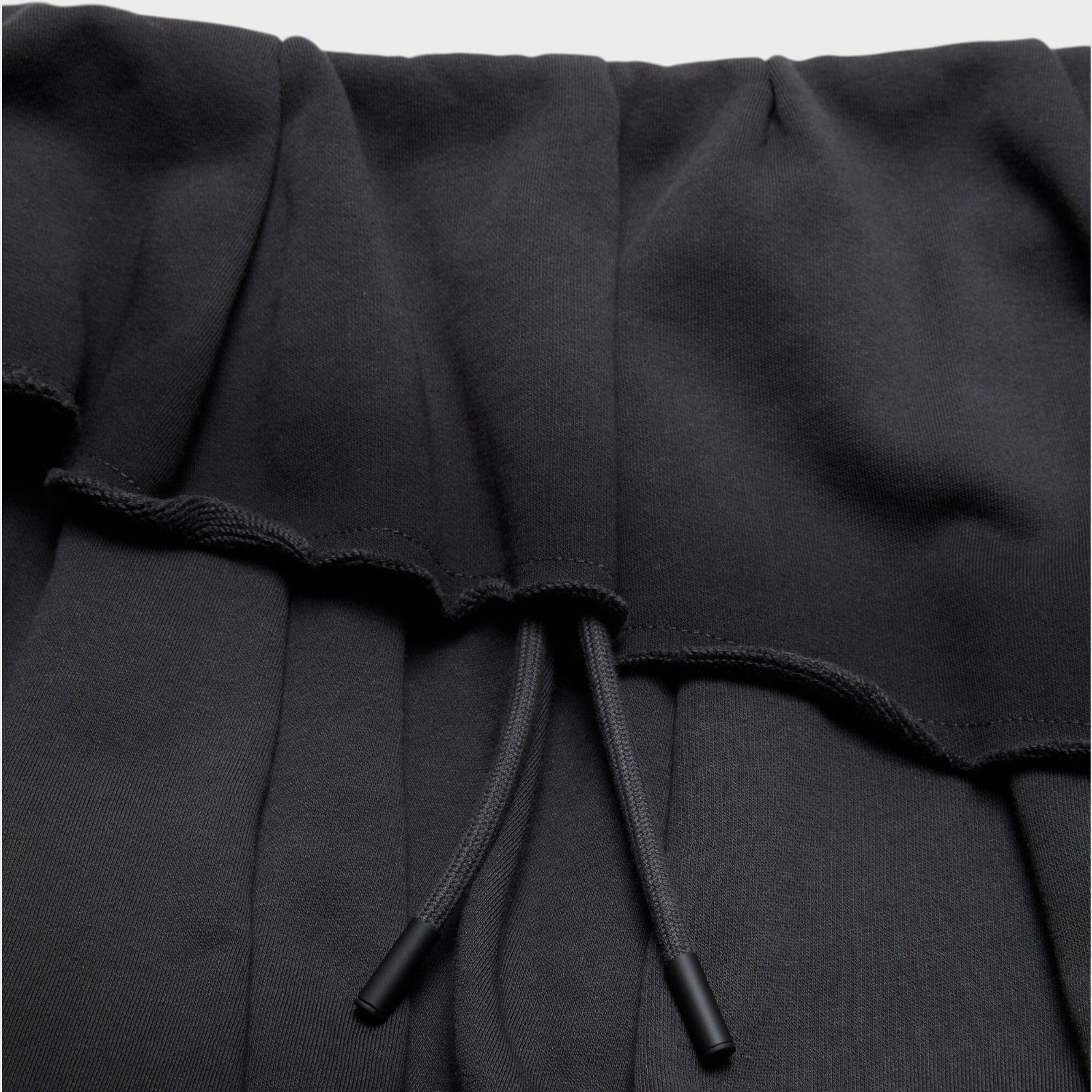 Tasoni black cotton tiered mini skirt with drawstring waist and raw hem details.
