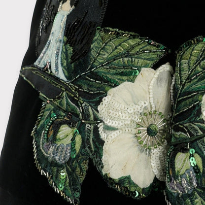 Tasoni black velvet shorts with embroidered floral patches, sequins, and beadwork. Features a high waist and pleated front.
