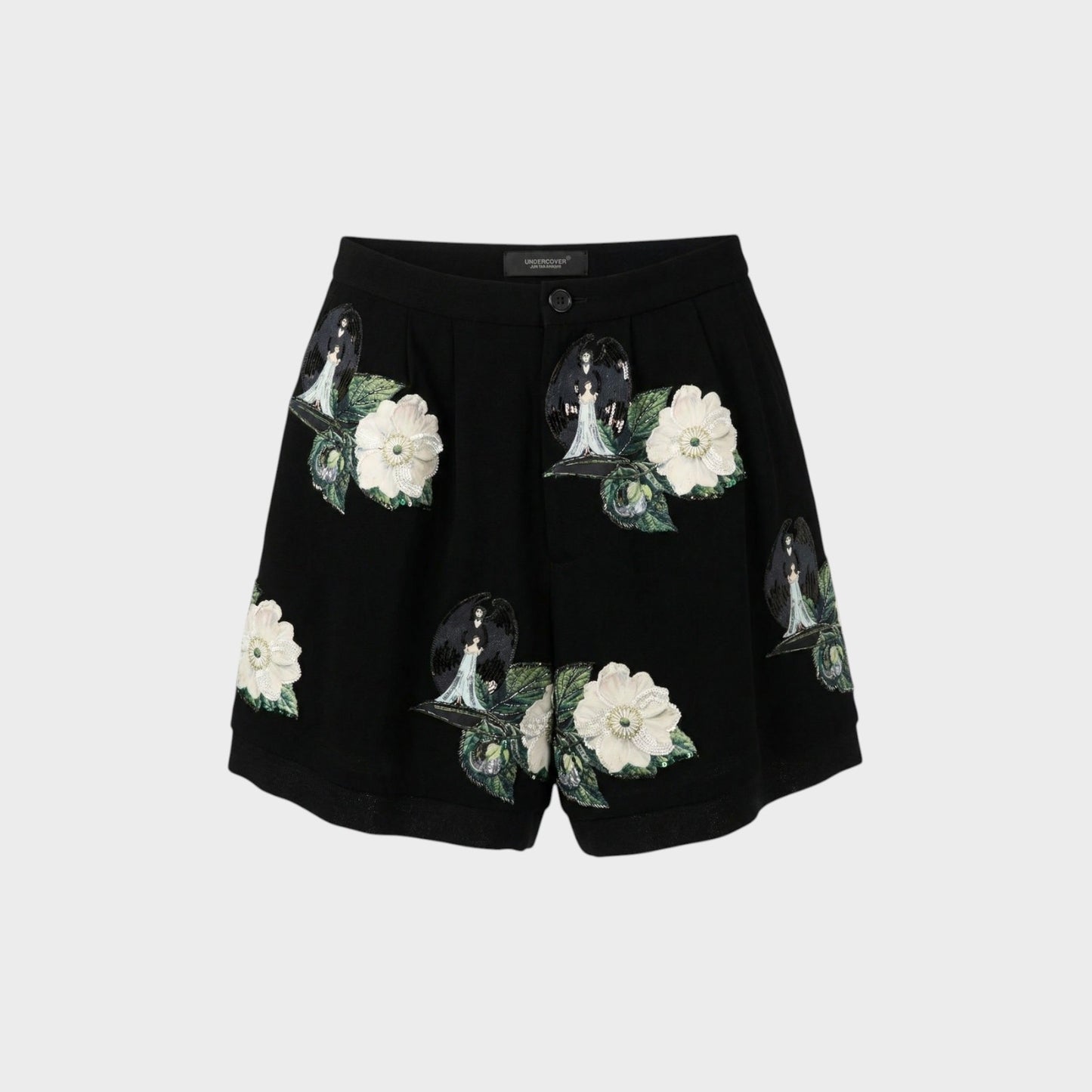 Tasoni black high-waist shorts with front pleats, featuring embroidered patches of white roses and figures with wings.