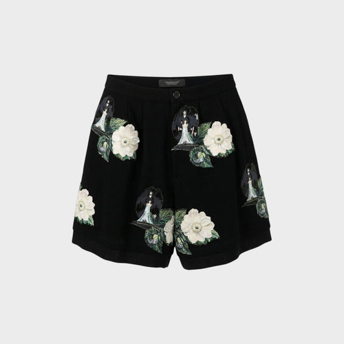 Tasoni black high-waist shorts with front pleats, featuring embroidered patches of white roses and figures with wings.