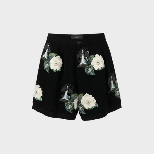 Tasoni black high-waist shorts with front pleats, featuring embroidered patches of white roses and figures with wings.