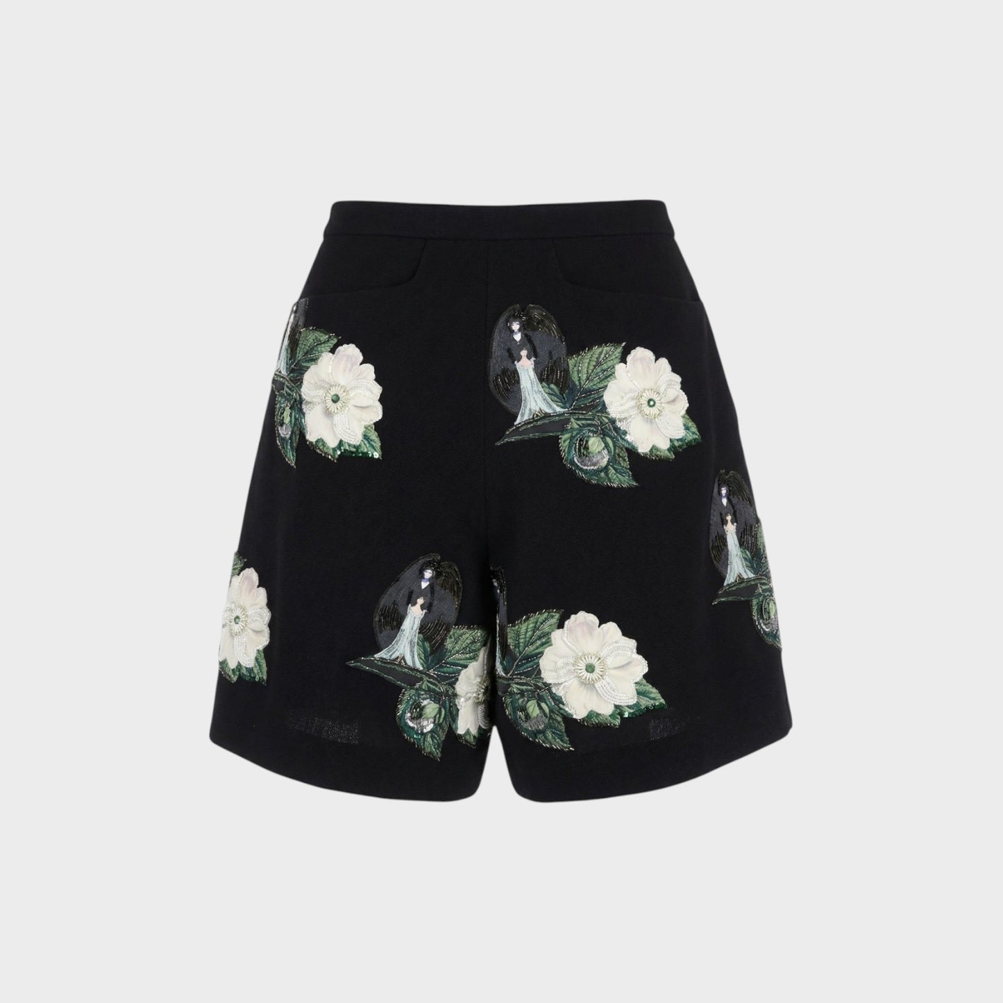 Tasoni black high-waist shorts with embroidered floral and figure patches. Features front pleats and a relaxed fit.
