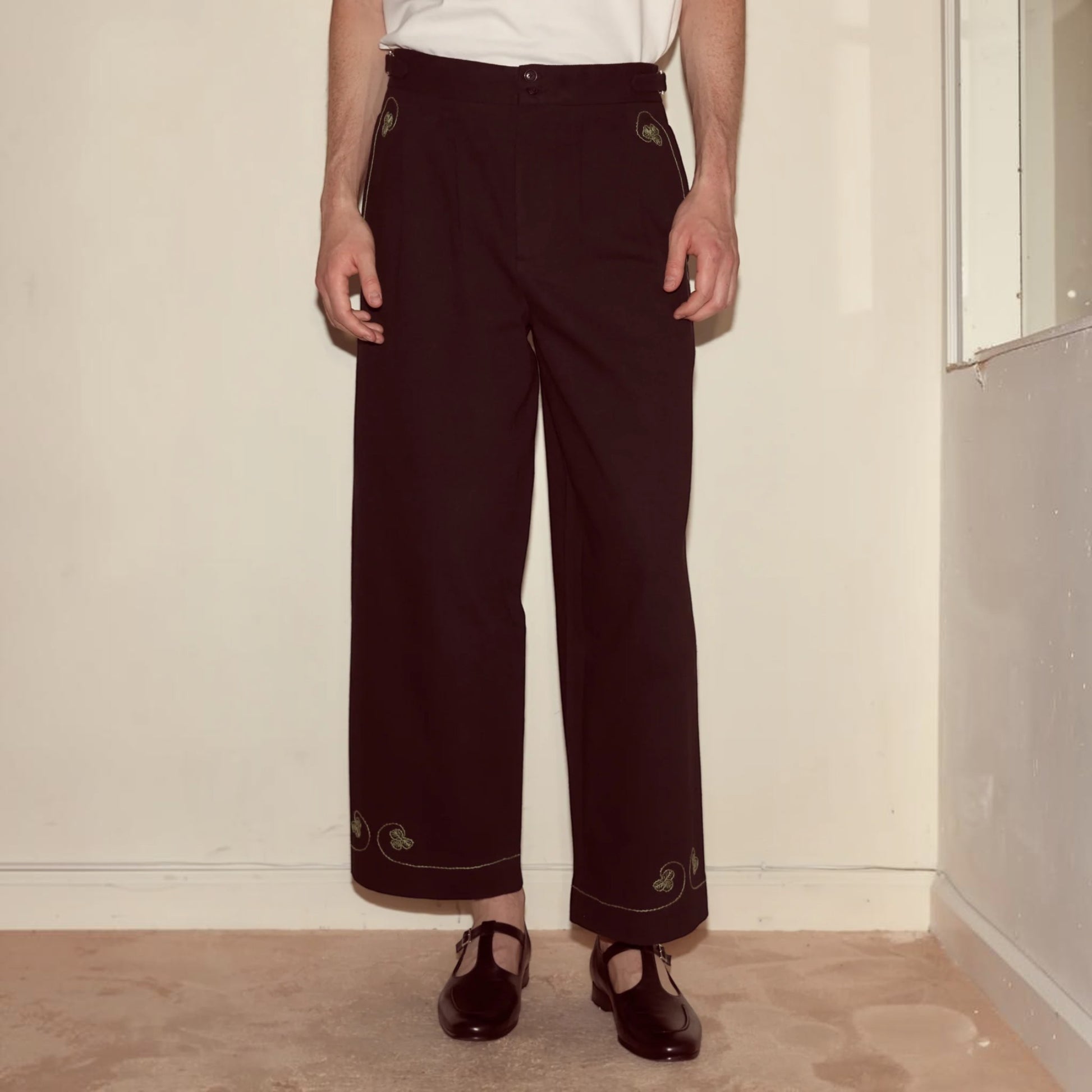 Tasoni black mid-rise trousers with embroidered playing card motifs on pockets and hem.