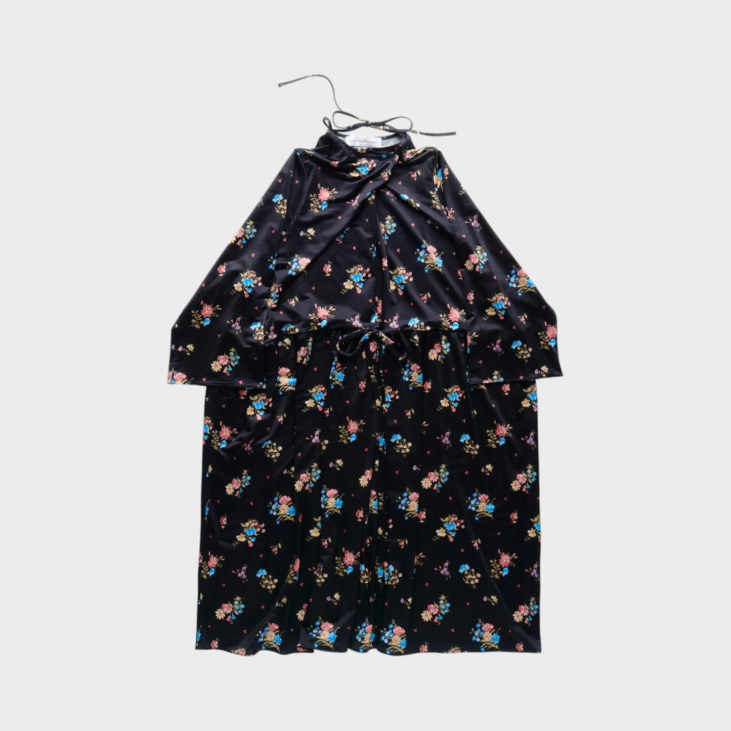 Tasoni black velvet long sleeve dress with a colorful floral print and a tie waist.