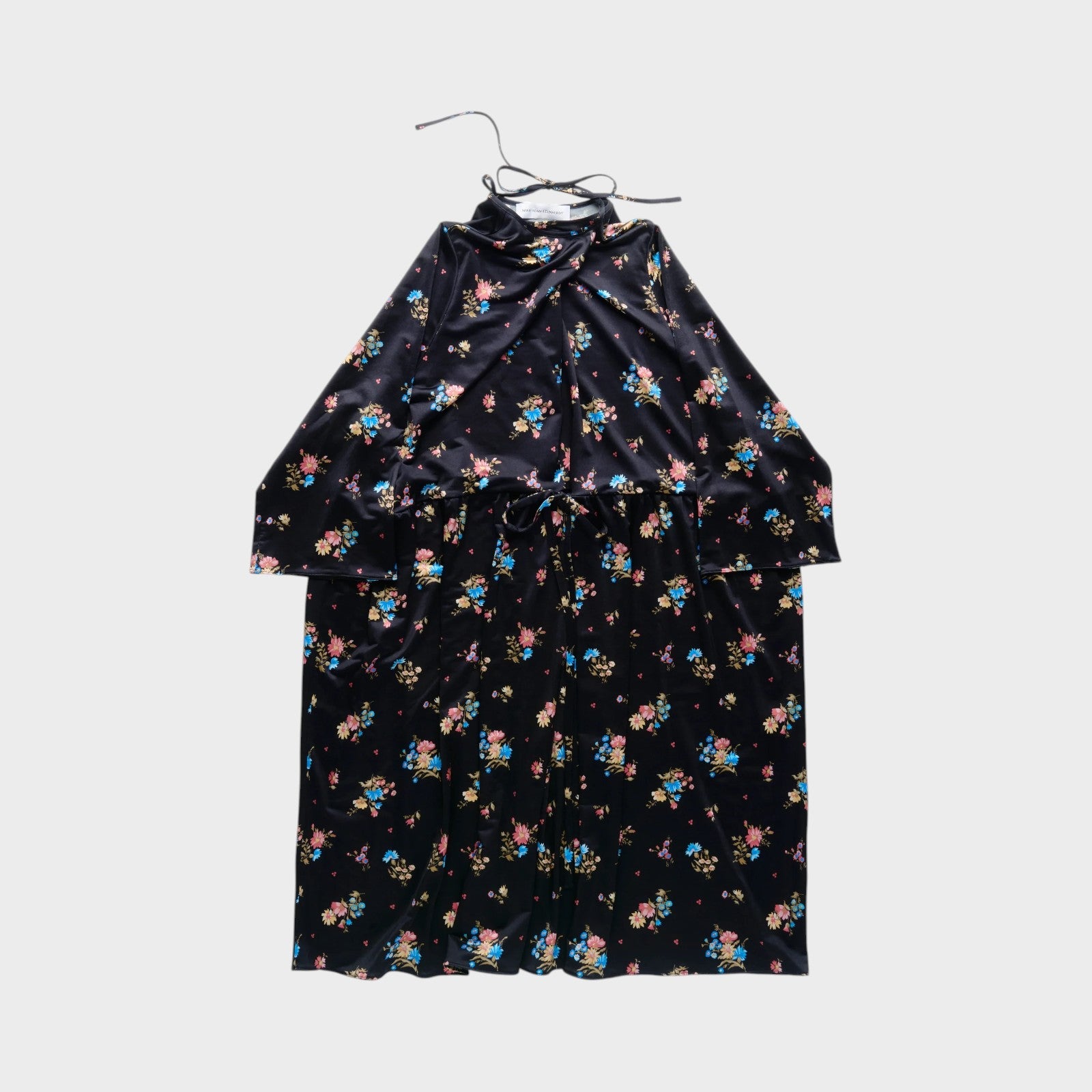 Tasoni black velvet long sleeve dress with a colorful floral print and a tie waist.