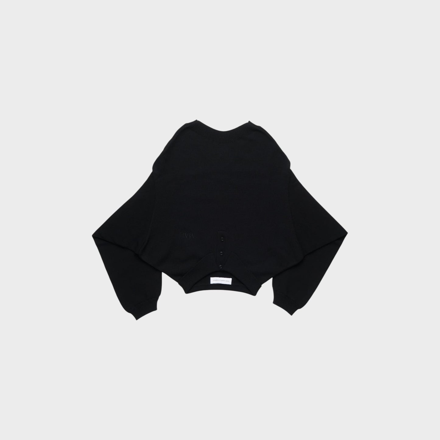 Tasoni black knit sweater with wide sleeves and button detail at the hem. Features a subtle embossed logo.