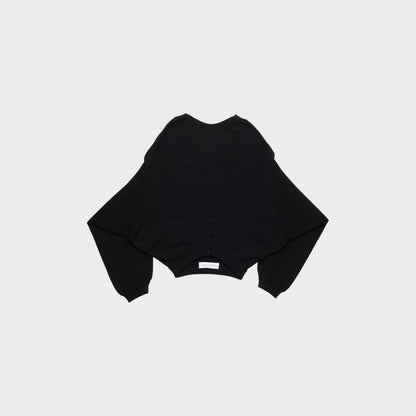 Tasoni black knit sweater with wide sleeves and button detail at the hem. Features a subtle embossed logo.